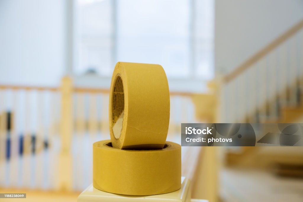Roll Of Yellow Painters Tape On Masking Tape From Painting Wall Stock Photo  - Download Image Now - iStock