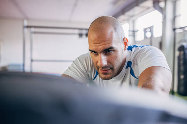 istock Athlete working out with tire 1188238161