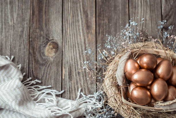 istock Background with Golden Easter eggs on wooden background. 1188239380
