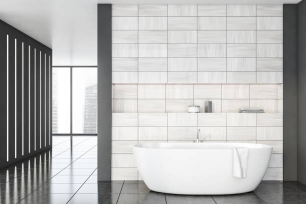 istock Gray and wooden tile bathroom interior with tub 1188239604