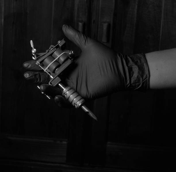 istock machine tattoo in hand in black and white 1188239655