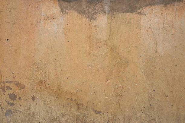 istock The texture of an old peeling concrete wall painted orange 1188239939
