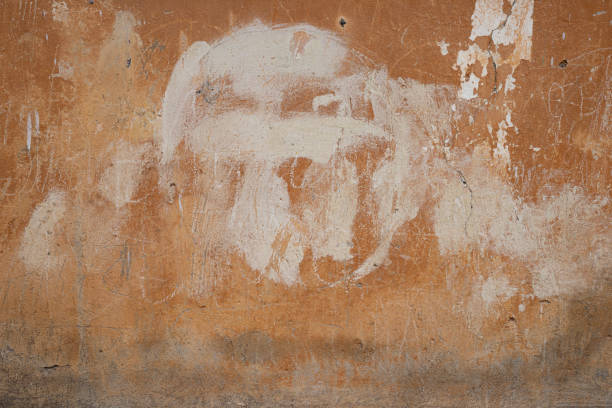 istock The texture of an old peeling concrete wall painted orange 1188239950
