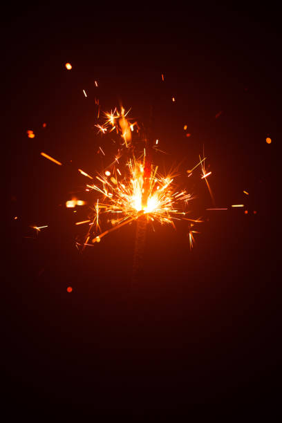 istock Christmas sparkler in haze with red light 1188240854