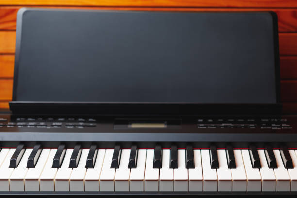 istock electric piano keys with music stand, copy-space background 1188241105