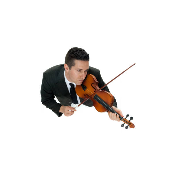 Directly above view / aerial view / full length / looking at camera / looking up / one man only / one person of adult handsome people caucasian male / young men violinist / musician / manager / businessman / business person standing wearing a suit