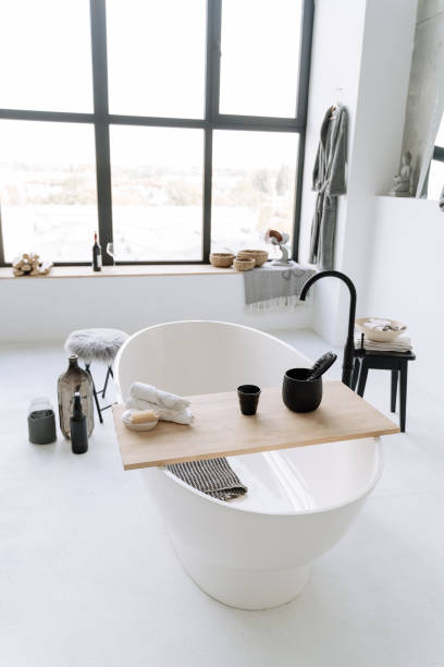 istock Urban Bathroom With Oval Bathtub Window Background 1188247913