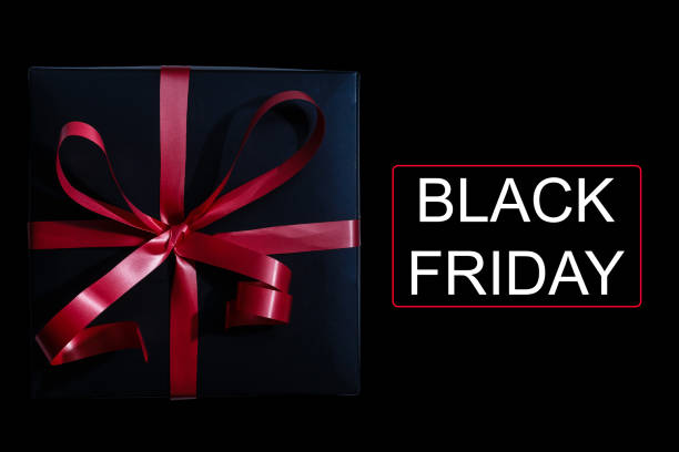 istock gift red ribbon on black background friday 1188248105