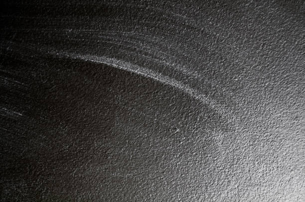 istock Wall grunge black concrete with light background. Dirty wall concrete blackboard texture and splash white color or abstract background. 1188252008