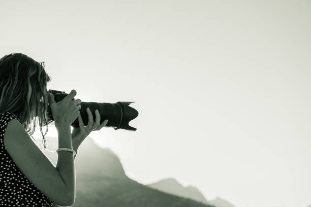 istock Young female photographer taking phozo outside 1188252762