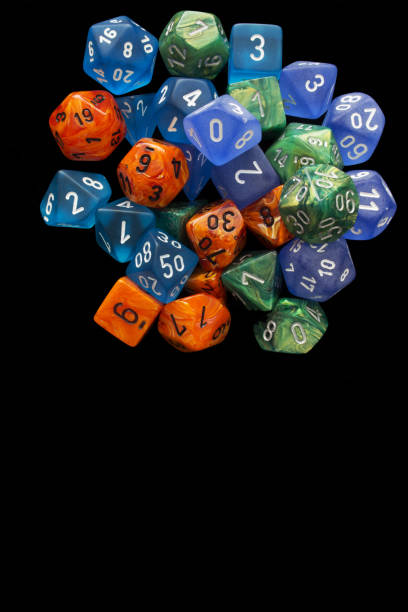 istock 4 RPG sets orange/blue/green for playing role playing games on black background. 1188253159