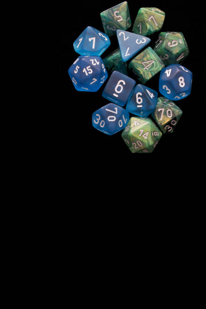 istock 2 RPG sets blue/green for playing role playing games on black background. 1188253171