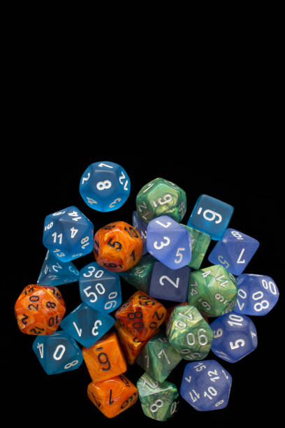 istock 4 RPG sets orange/blue/green for playing role playing games on black background. 1188253176
