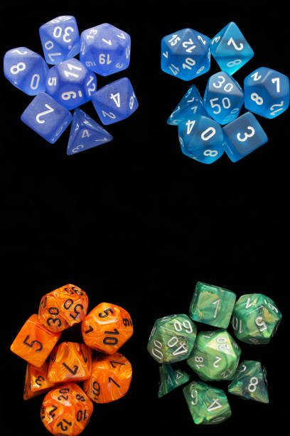 istock 4 RPG sets orange/blue/green for playing role playing games on black background. 1188253188