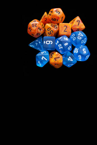 istock 2 RPG sets orange/blue for playing role playing games on black background. 1188253198