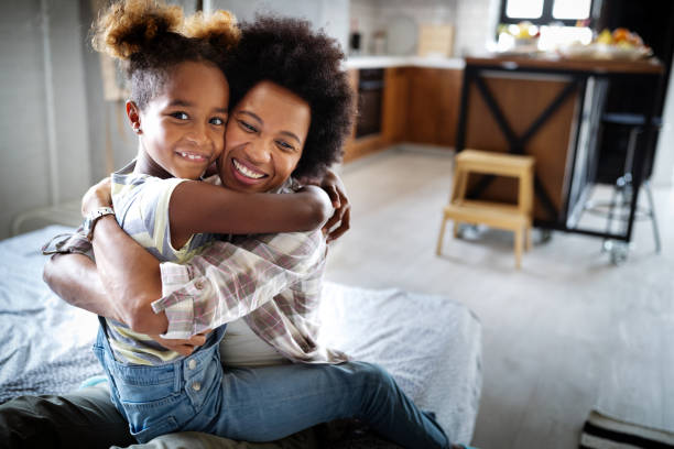 istock Happy mother playing, having fun, hugging with her daughter at home 1188258023