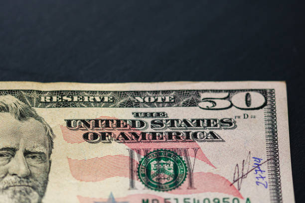 istock Money on the table, dollars on black table. Business concept 1188258873