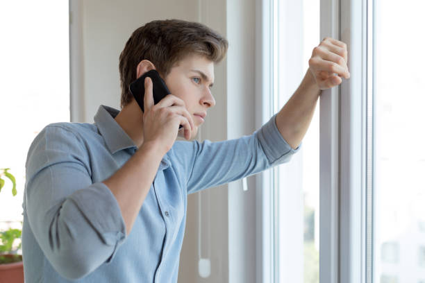 istock Unhappy man looking out of the window 1188261874