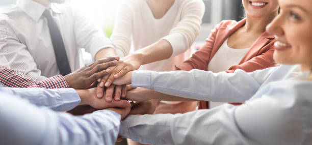 stack of hands. unity and teamwork concept. - hand raised arms raised multi ethnic group human hand imagens e fotografias de stock