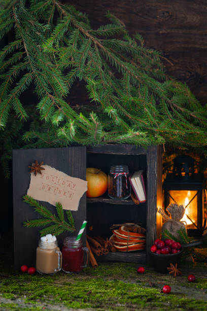istock Christmas magic wooden cupboard with holiday drinks and ingredients, postcard concept, with a lantern burning 1188264296