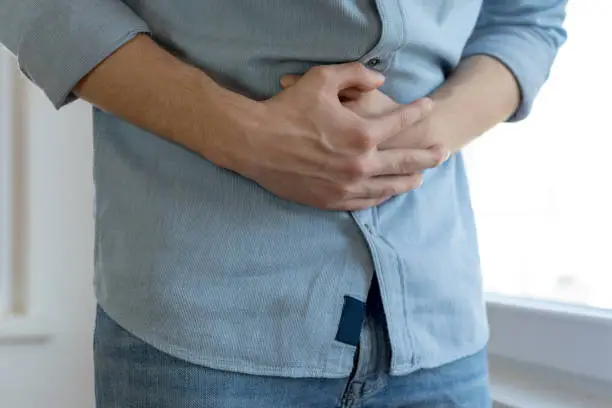 Young man having stomach ache