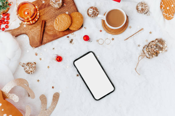 istock Flat lay phone mock up. Cozy winter holiday. Christmas background with decorations on a light background. 1188265592