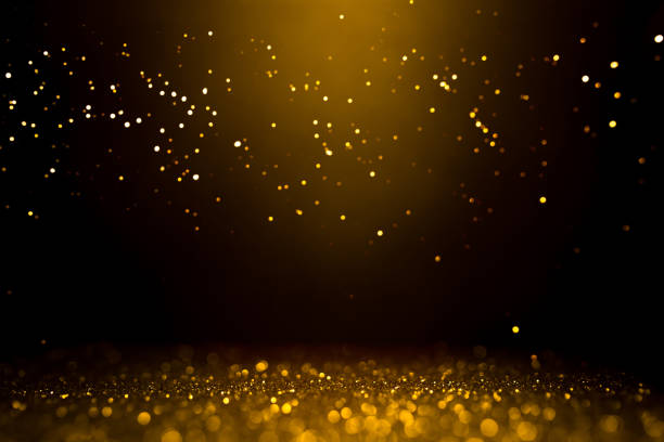 istock Golden abstract bokeh on black background. 1188266778