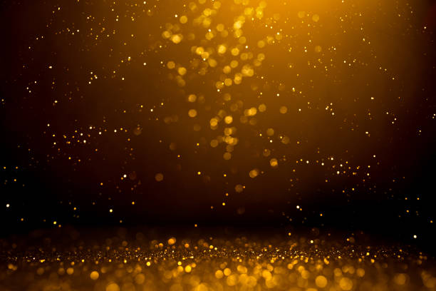 istock Golden abstract bokeh on black background. 1188266780