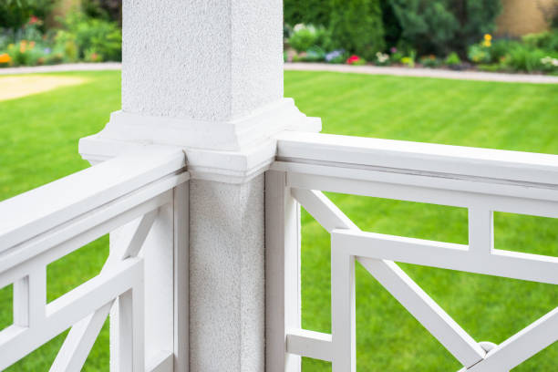 White fence with columns on the seashore.