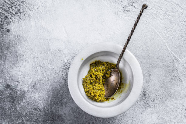 istock Italian  Pesto in marble mortar. Space for text. Gray background 1188271017