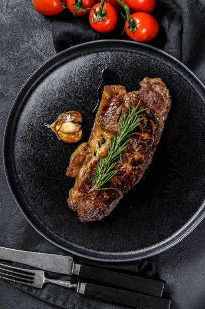 istock Beef rump steak on black background. Space for text. Marble premium beef 1188271666