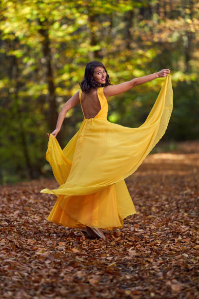 istock Beautiful woman dancing in the forest 1188276257