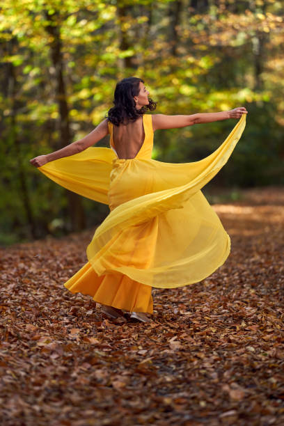 istock Beautiful woman dancing in the forest 1188276267