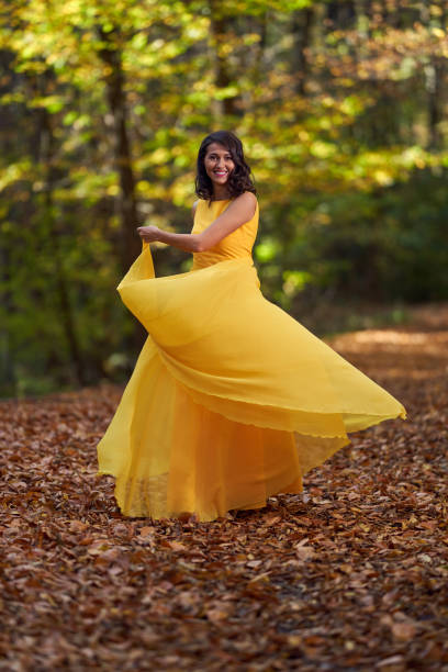 istock Beautiful woman dancing in the forest 1188276272