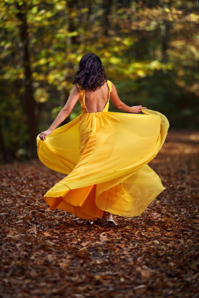 istock Beautiful woman dancing in the forest 1188276281