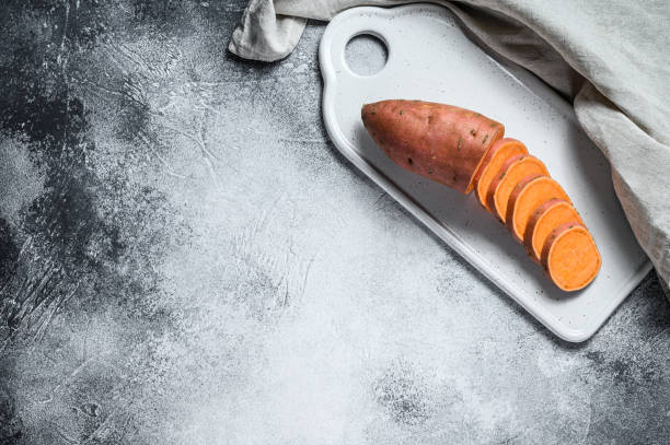 istock Raw yam, organic batatas. The farm vegetables. Gray background. Space for text 1188279841