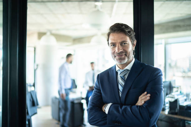 Portrait of a confident businessman Portrait of a confident businessman bank manager stock pictures, royalty-free photos & images