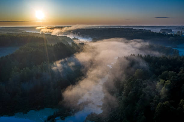 istock Flying above stunning mist over river in sunrise in autumn 1188280011