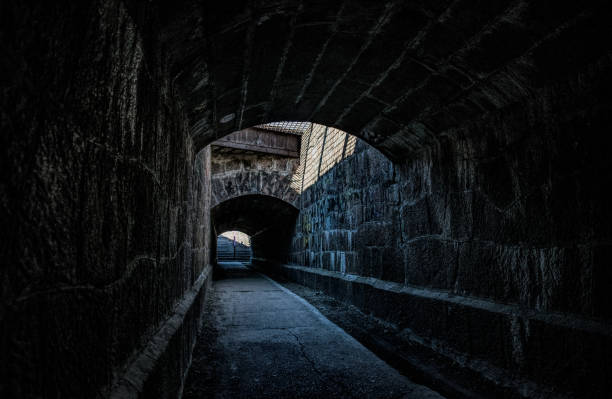 istock Old creepy underground stone tunnel. Halloween Locations 1188283968