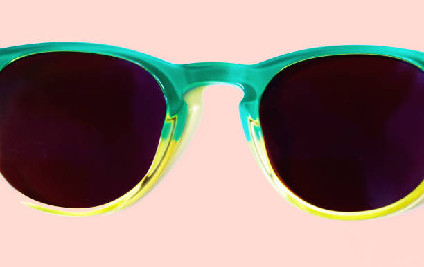 istock Sunglasses with Green Frames Close-Up, Millennial Pink Background 1188285890