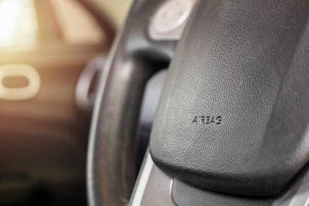 istock Safety airbag sign on car steering wheel 1188287809