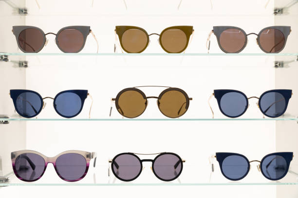 istock Protective eyewear designed primarily to prevent bright sunlight and high-energy visible light from damaging or discomforting eyes, front view at shopping centre mall shelf. 1188287835