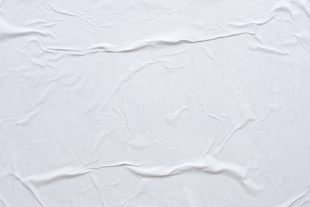 istock Blank white crumpled and creased paper poster texture background 1188287968