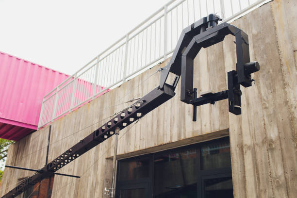 Television studio with jib camera and lights - camera on a crane. Shallow depth of field.