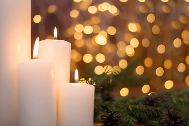 istock Tree branches, cones, bokeh lights, candles. Preparation for the New Year 1188289151