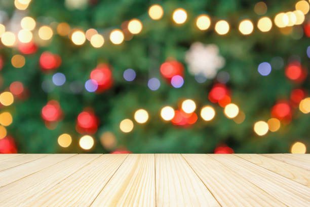istock Empty wood table top with Abstract blur Christmas tree with decoration bokeh light background for product display 1188289214