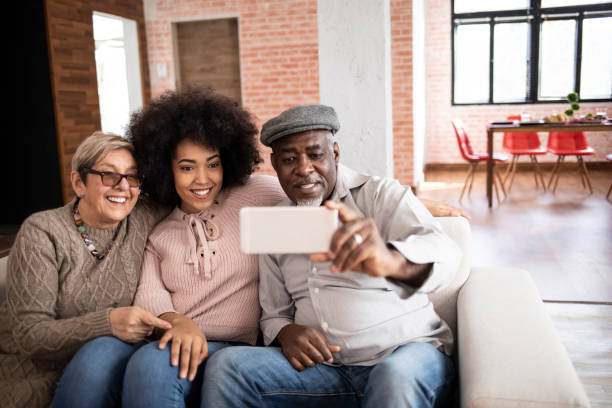 istock Happy multi-ethnic family taking selfie at home 1188289273
