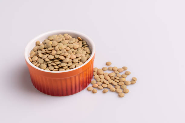 istock Dry uncooked lentils isolated on white background, copy space, studio shot, soft light. Christmas and New Year dish 1188289344