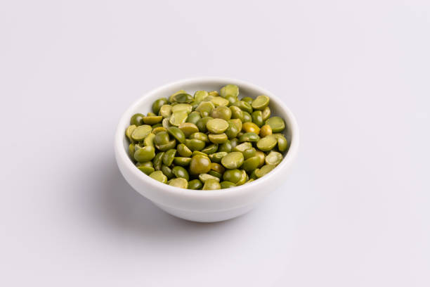 istock Split dried uncooked peas isolated on white background, close-up, studio shot, soft light, copy space. Christmas dish 1188294015