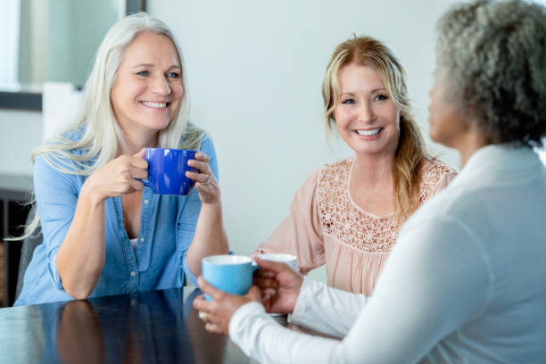 istock Senior ladies enjoying coffee together 1188296131
